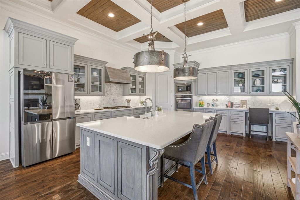 2009 Tree Top Court Granbury, TX 76049 - Photo 14 of 40 a large kitchen with a table and chairs