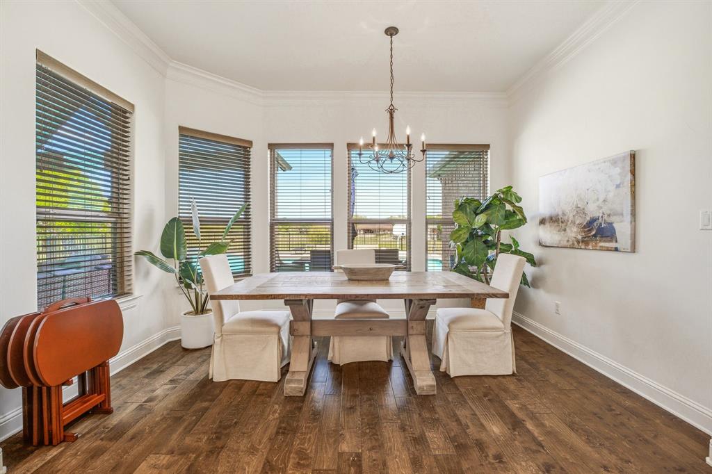 2009 Tree Top Court Granbury, TX 76049 - Photo 18 of 40 a view of a dining room with furniture window and wooden floor