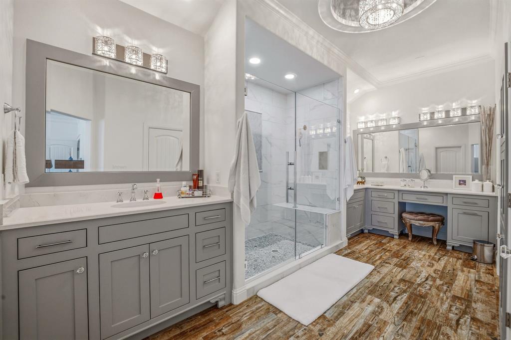 2009 Tree Top Court Granbury, TX 76049 - Photo 24 of 40 a bathroom with a sink a toilet a mirror and shower