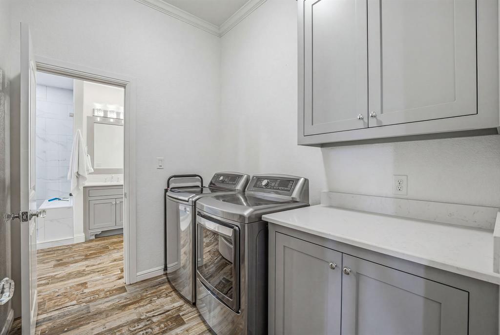 2009 Tree Top Court Granbury, TX 76049 - Photo 26 of 40 a utility room with dryer and washer