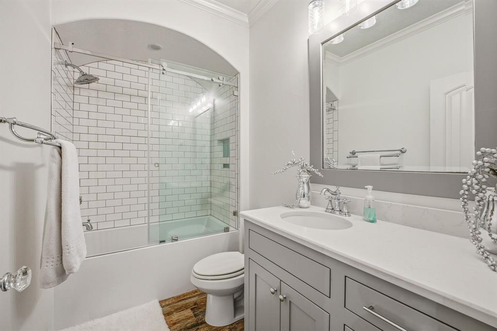 2009 Tree Top Court Granbury, TX 76049 - Photo 28 of 40 a bathroom with a sink a toilet and shower