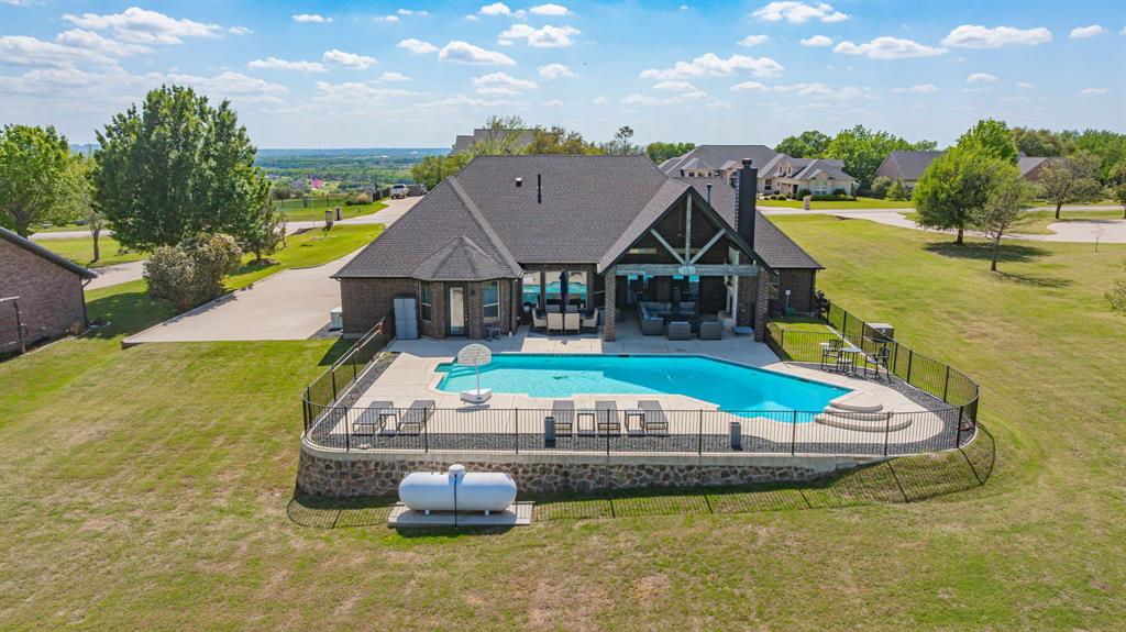 2009 Tree Top Court Granbury, TX 76049 - Photo 37 of 40 a aerial view of a house with swimming pool and ocean view