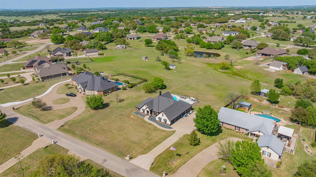 2009 Tree Top Court Granbury, TX 76049 - Photo 38 of 40 an aerial view of residential houses with outdoor space
