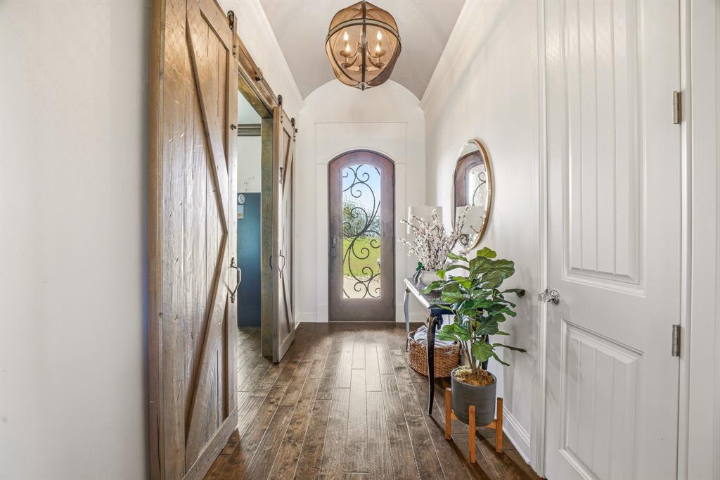 2009 Tree Top Court Granbury, TX 76049 - Photo 6 of 40 a view of a door of the house with wooden floor