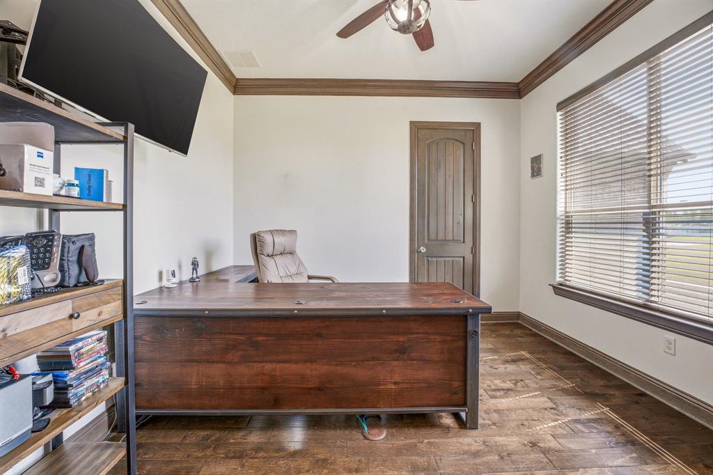 2009 Tree Top Court Granbury, TX 76049 - Photo 7 of 40 a living room with hard wood floors and a window