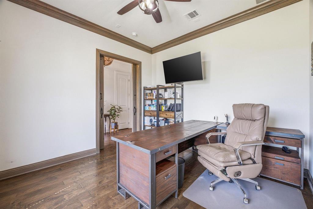 2009 Tree Top Court Granbury, TX 76049 - Photo 8 of 40 a living room with furniture and a flat screen tv