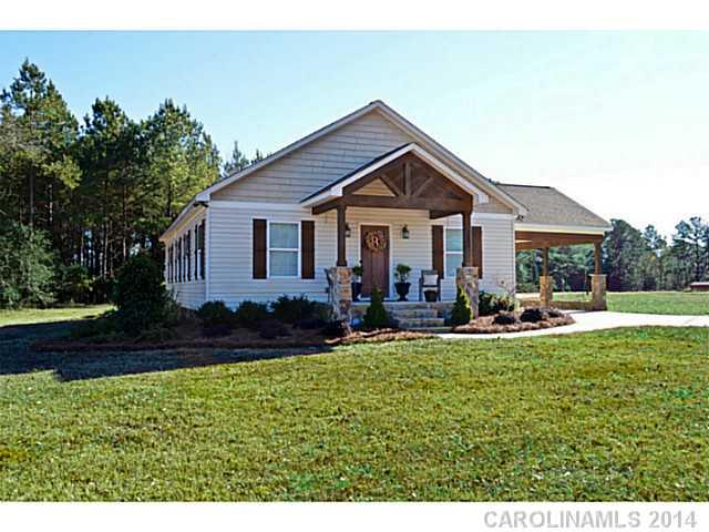 3334 Beaty Road Gastonia, NC 28056 - Photo 1 of 16 a view of a house with a yard patio and sitting area