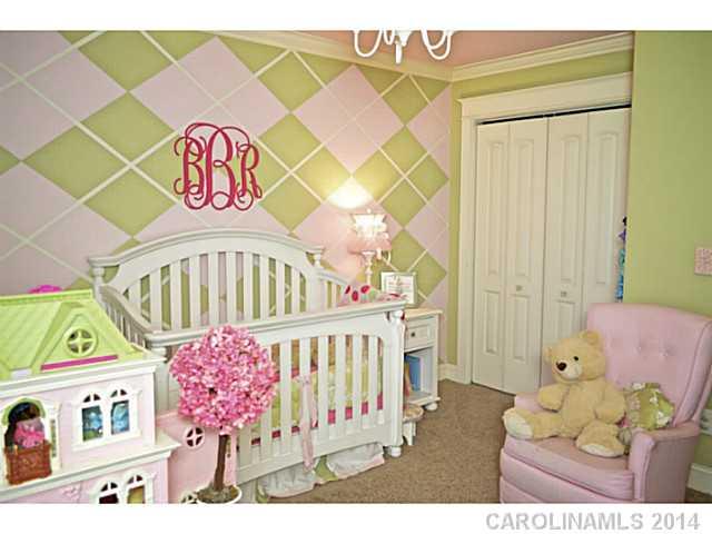 3334 Beaty Road Gastonia, NC 28056 - Photo 13 of 16 a bedroom with a bed and a baby crib
