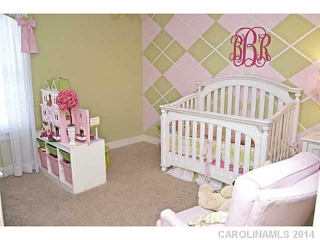 3334 Beaty Road Gastonia, NC 28056 - Photo 14 of 16 a bedroom with a bed and a white wall