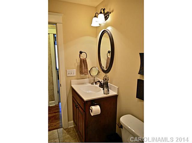 3334 Beaty Road Gastonia, NC 28056 - Photo 16 of 16 a bathroom with a sink and a mirror