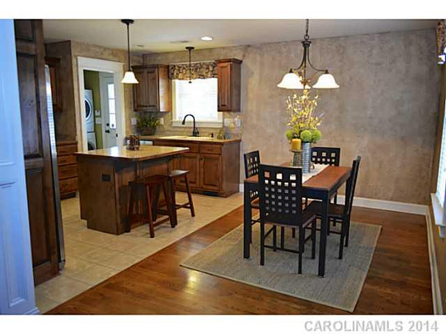 3334 Beaty Road Gastonia, NC 28056 - Photo 5 of 16 a view of a dining room with furniture wooden floor and chandelier
