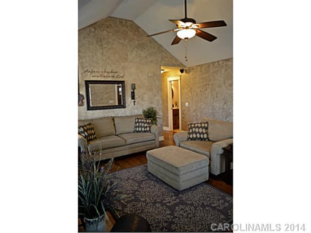3334 Beaty Road Gastonia, NC 28056 - Photo 7 of 16 a living room with furniture and a chandelier