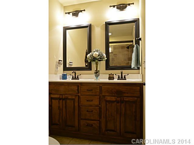 3334 Beaty Road Gastonia, NC 28056 - Photo 10 of 16 a bathroom with a sink and a mirror