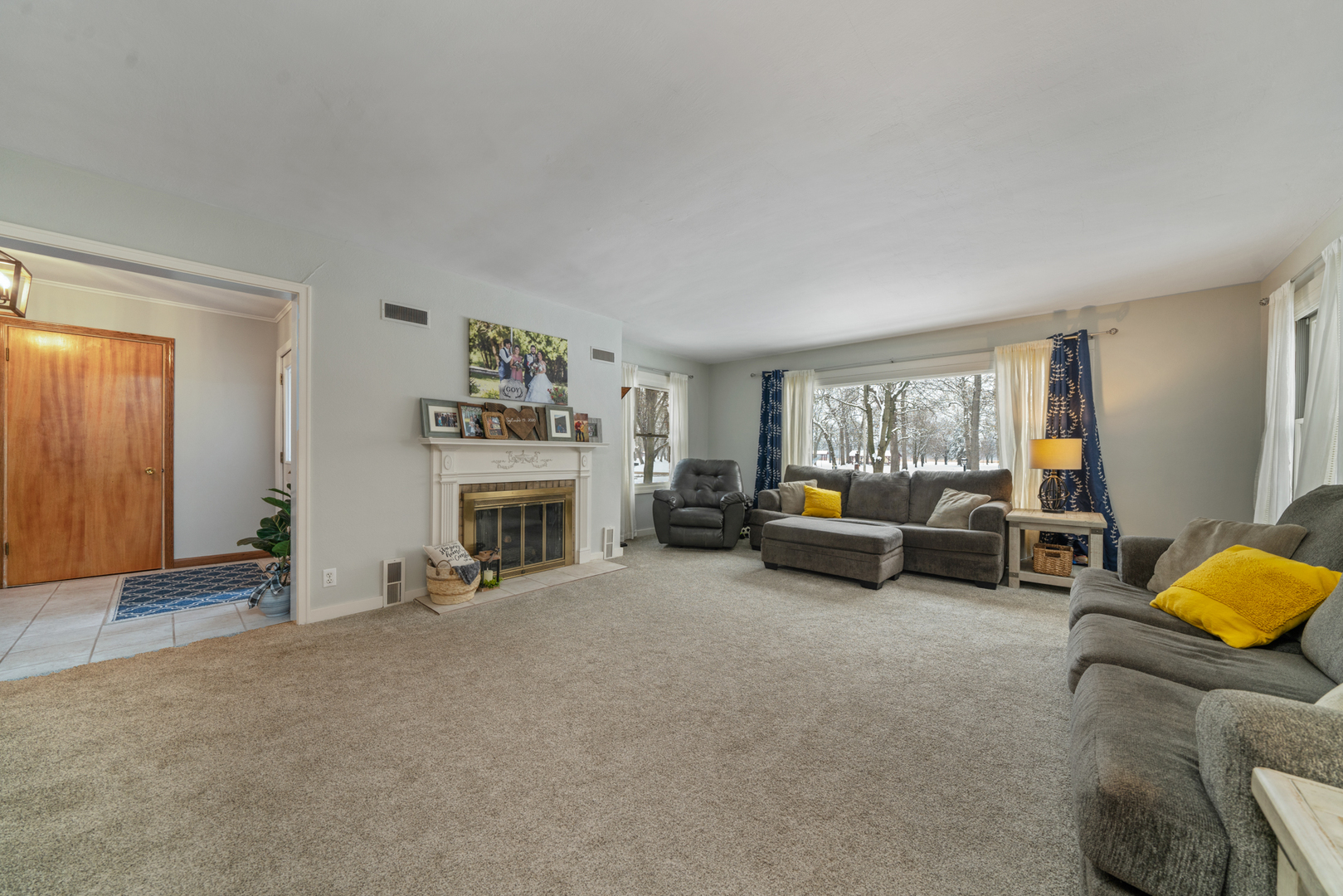 1628 Lee Center Road Amboy, IL 61310 - Photo 15 of 33 a living room with furniture and a fireplace