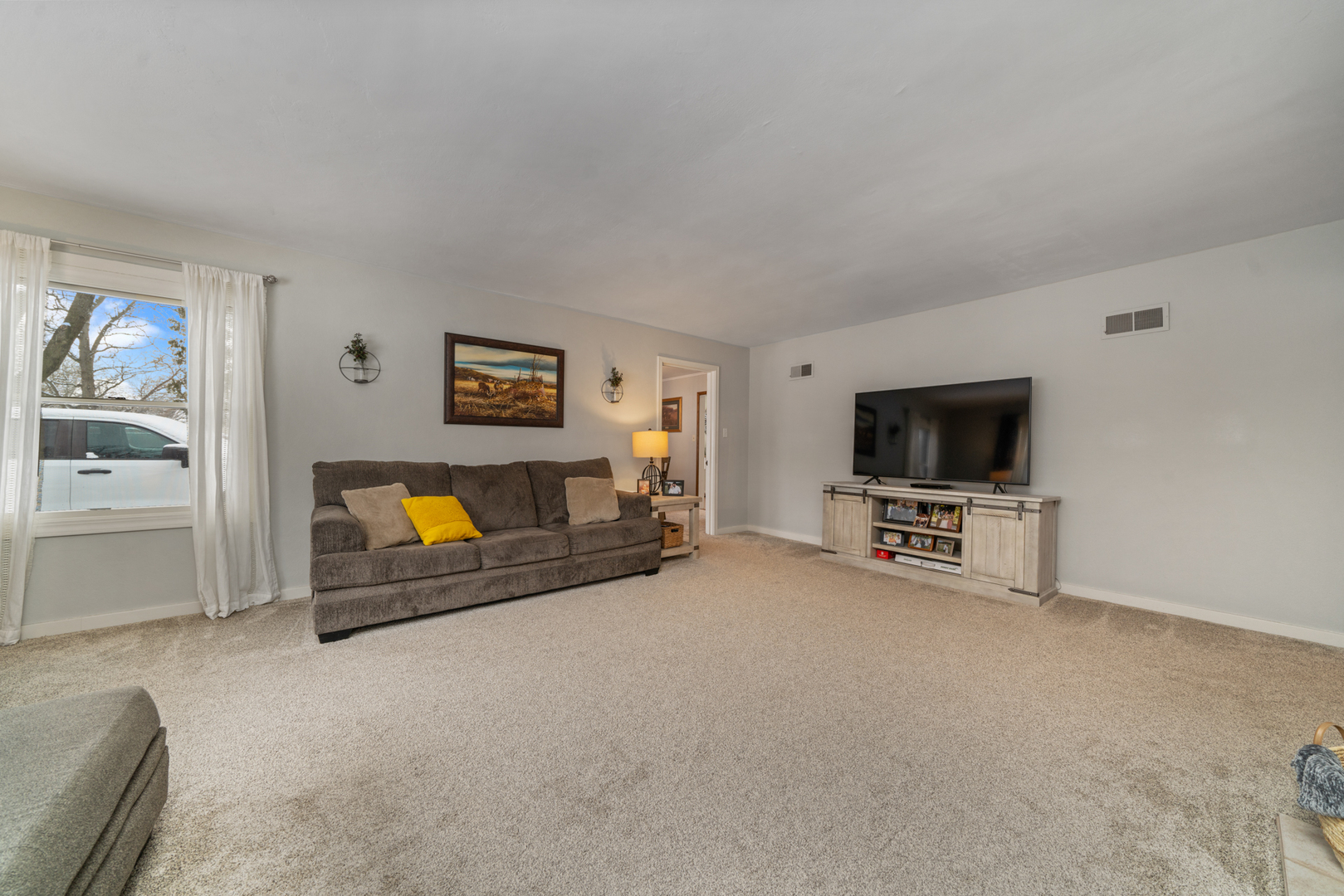 1628 Lee Center Road Amboy, IL 61310 - Photo 16 of 33 a living room with furniture and a flat screen tv