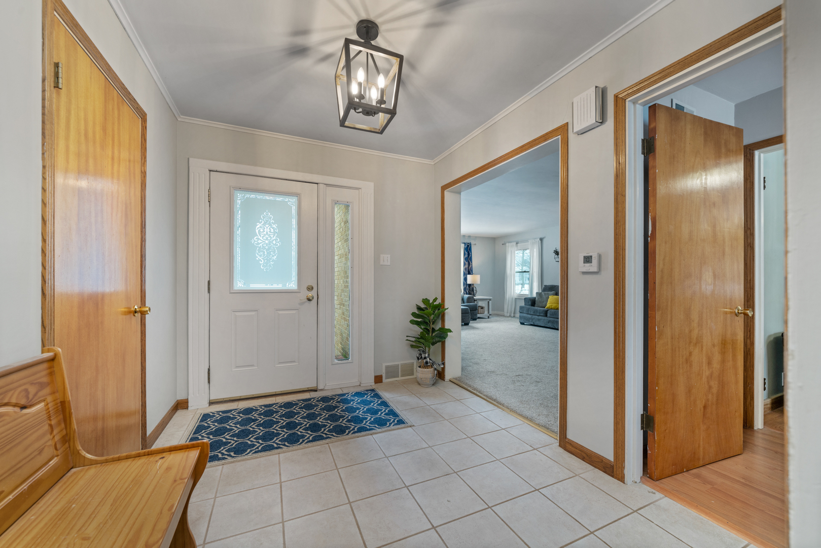 1628 Lee Center Road Amboy, IL 61310 - Photo 3 of 33 a view of a hallway with wooden floor and cabinet