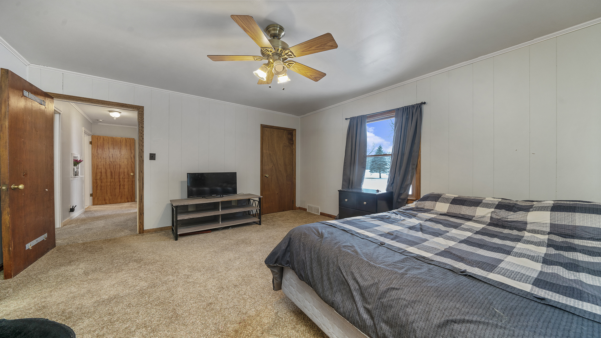 1628 Lee Center Road Amboy, IL 61310 - Photo 5 of 33 a bedroom with a bed and a chandelier