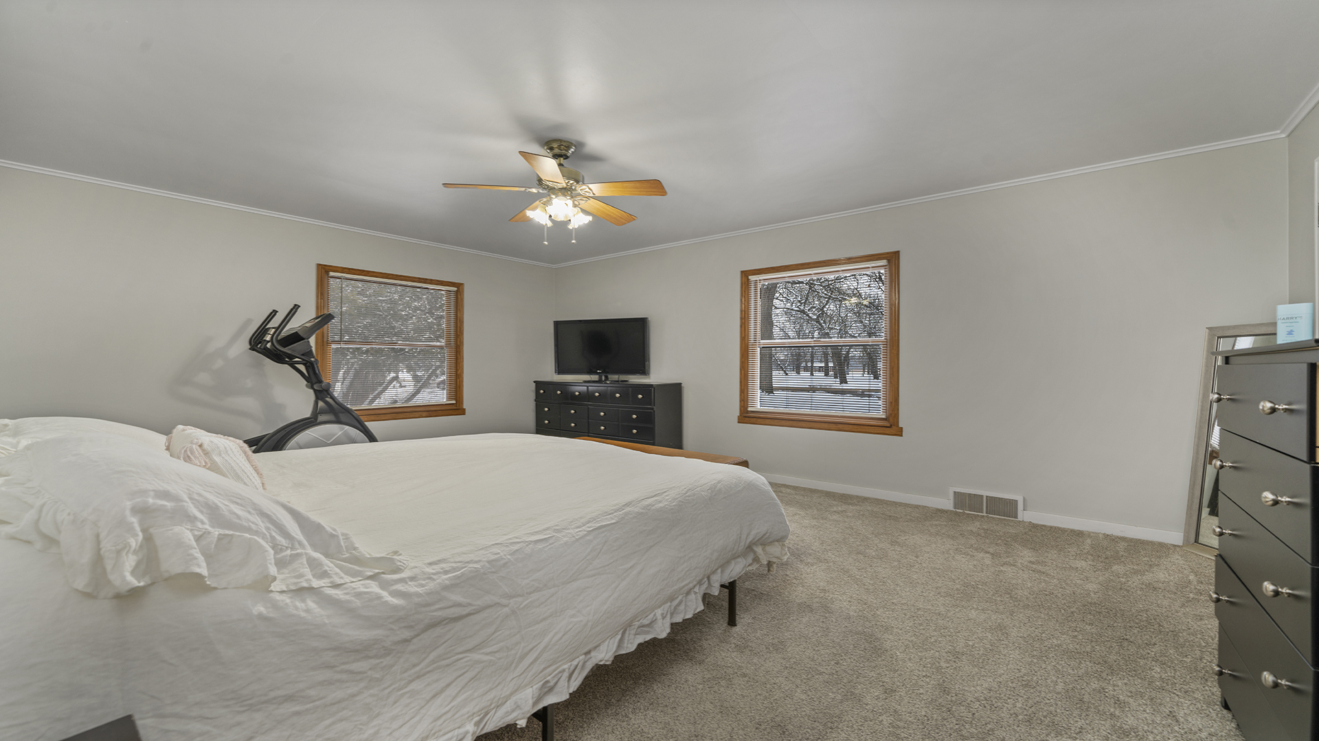 1628 Lee Center Road Amboy, IL 61310 - Photo 6 of 33 a bedroom with a large bed and a chandelier