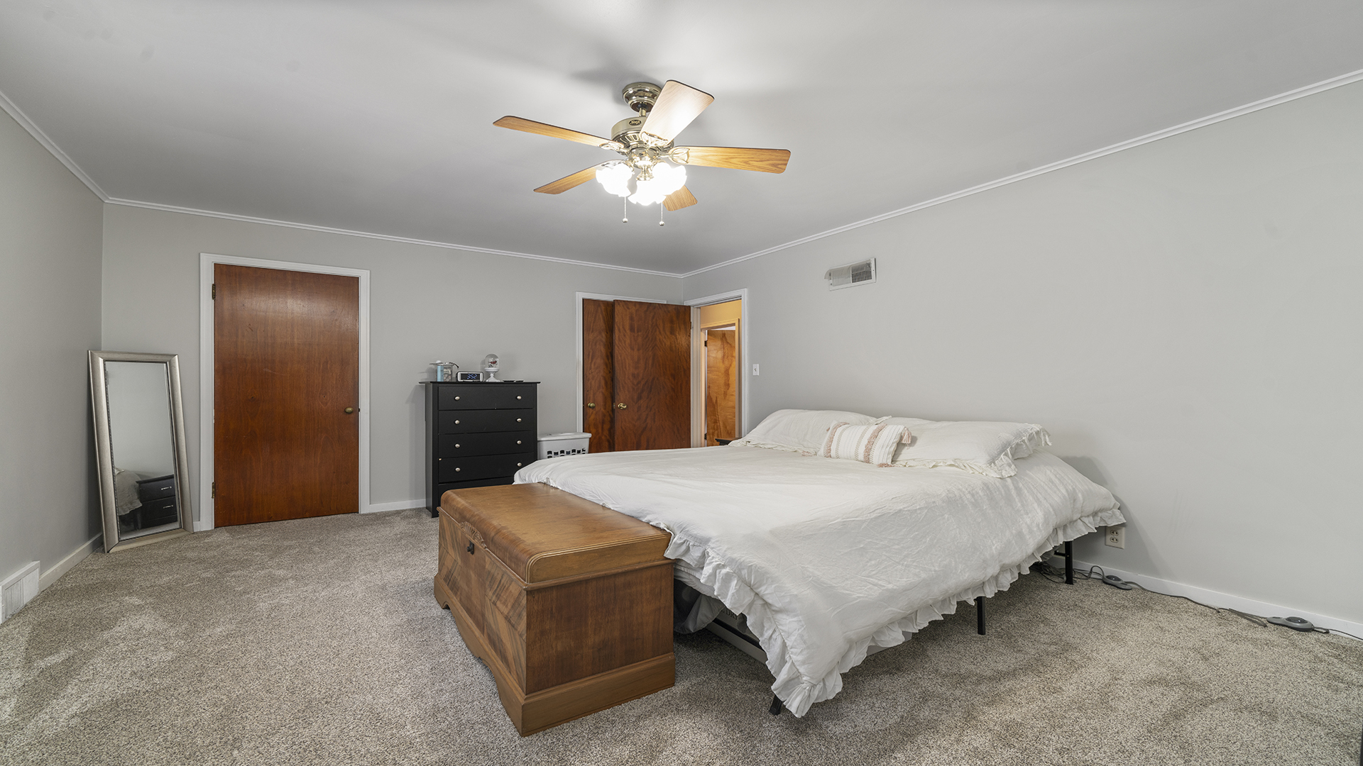 1628 Lee Center Road Amboy, IL 61310 - Photo 7 of 33 a spacious bedroom with a bed and a chandelier