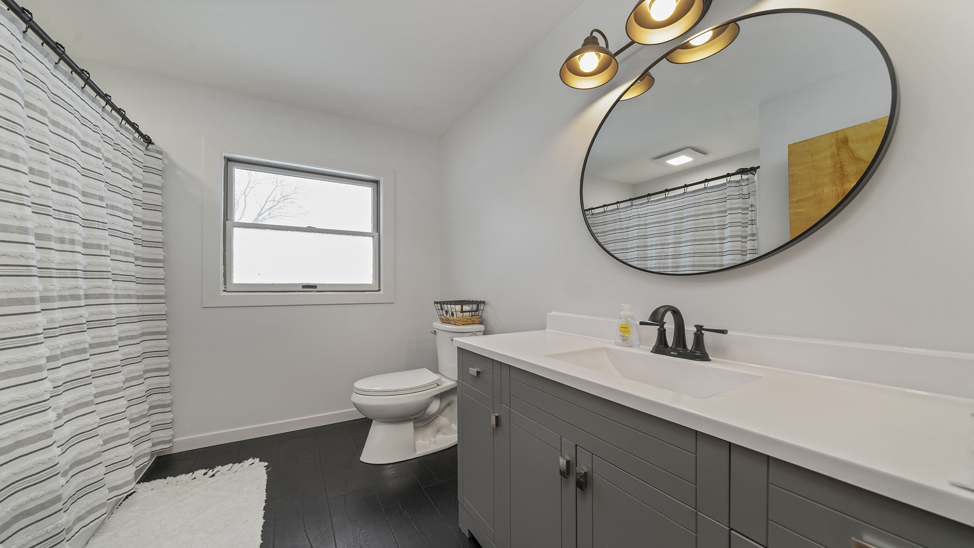 1628 Lee Center Road Amboy, IL 61310 - Photo 8 of 33 a bathroom with a sink and a mirror