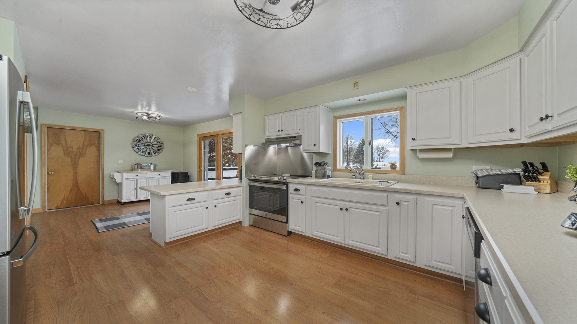 1628 Lee Center Road Amboy, IL 61310 - Photo 10 of 33 a large white kitchen with cabinets