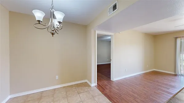 a view of room with empty room and wooden floor