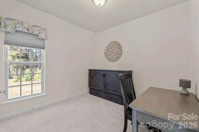 a kitchen with stainless steel appliances granite countertop a stove sink and microwave
