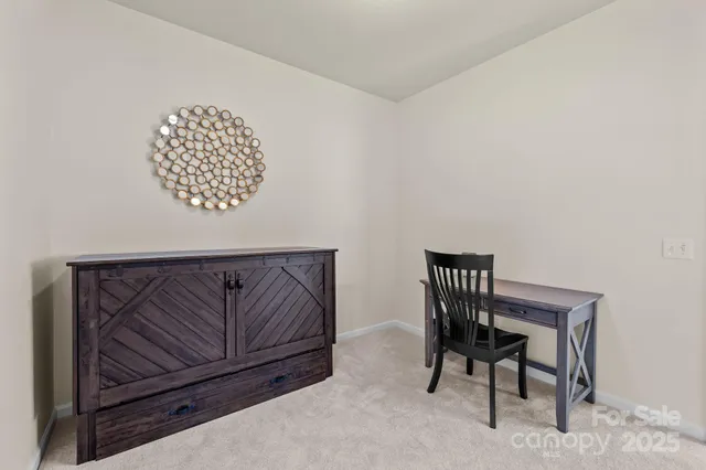 a view of a livingroom with furniture