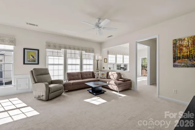 an aerial view of a house with swimming pool and sitting space