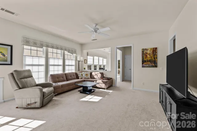 a view of a couches and dinning table and chair in the patio