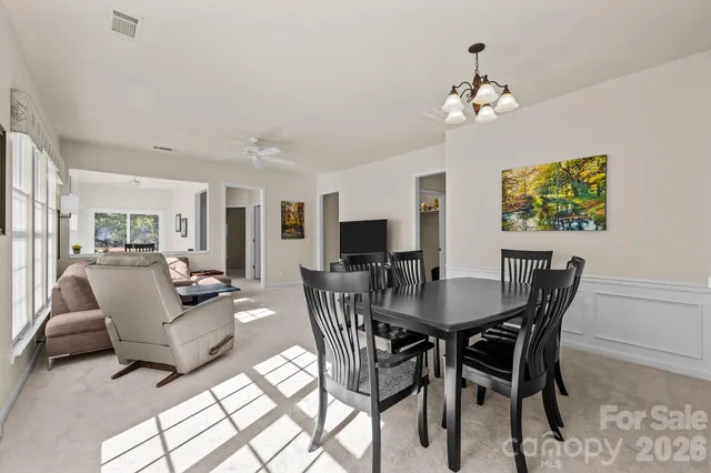 an aerial view of a residential houses with city view