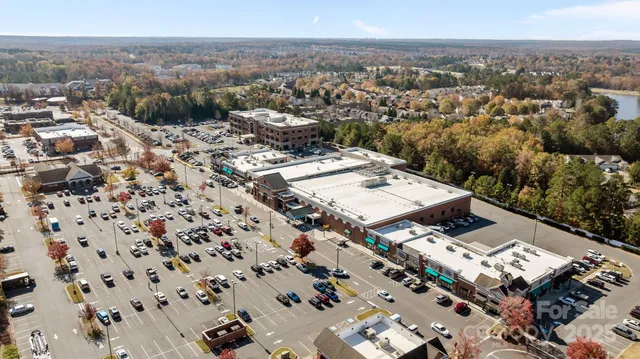 an aerial view of a residential houses with city view