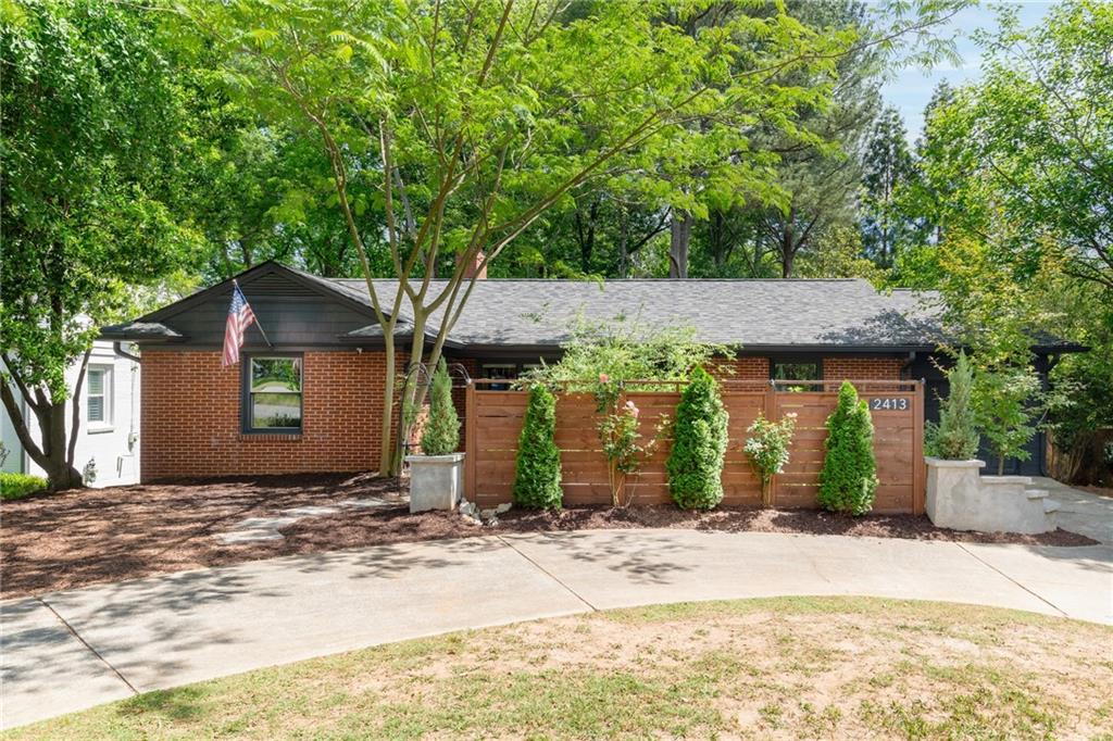 2413 North Decatur Road Decatur, GA 30033 - Photo 1 of 33 a front view of a house with a yard