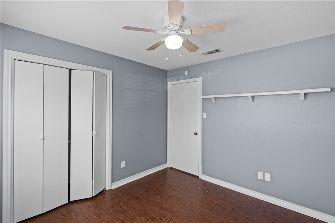 401 Park Road, Unit AB College Station, TX 77840 - Photo 12 of 22 a view of an empty room with a ceiling fan