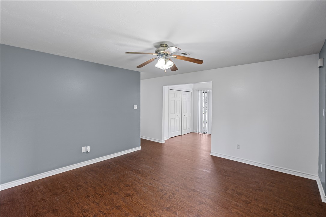 401 Park Road, Unit AB College Station, TX 77840 - Photo 5 of 22 a view of a room with wooden floor and a ceiling fan