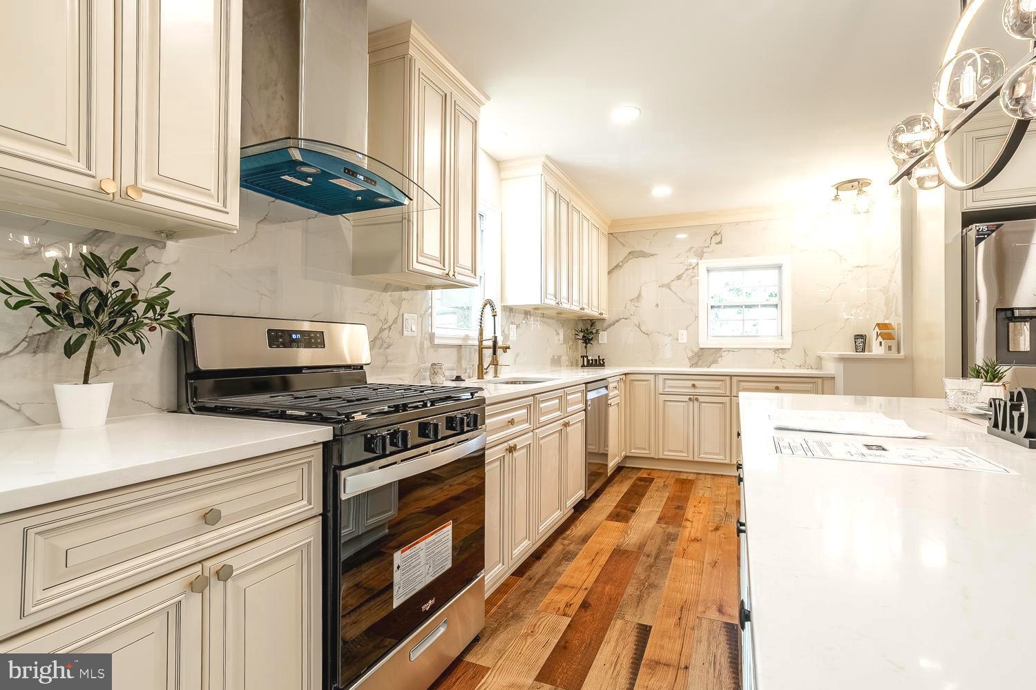 431 East Park Avenue Maple Shade, NJ 08052 - Photo 13 of 36 a kitchen with a white stove top oven and white cabinets