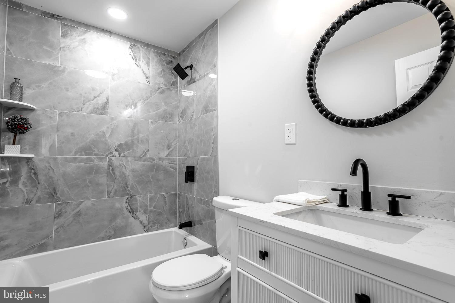 431 East Park Avenue Maple Shade, NJ 08052 - Photo 18 of 36 a bathroom with a sink a toilet and a mirror