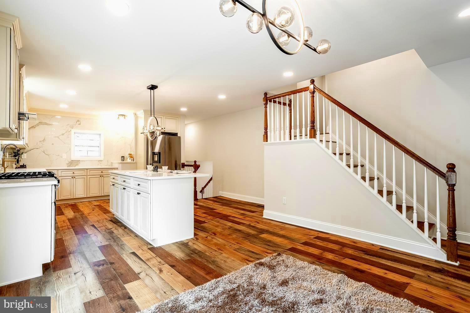 431 East Park Avenue Maple Shade, NJ 08052 - Photo 6 of 36 a view of kitchen and hall with wooden floor