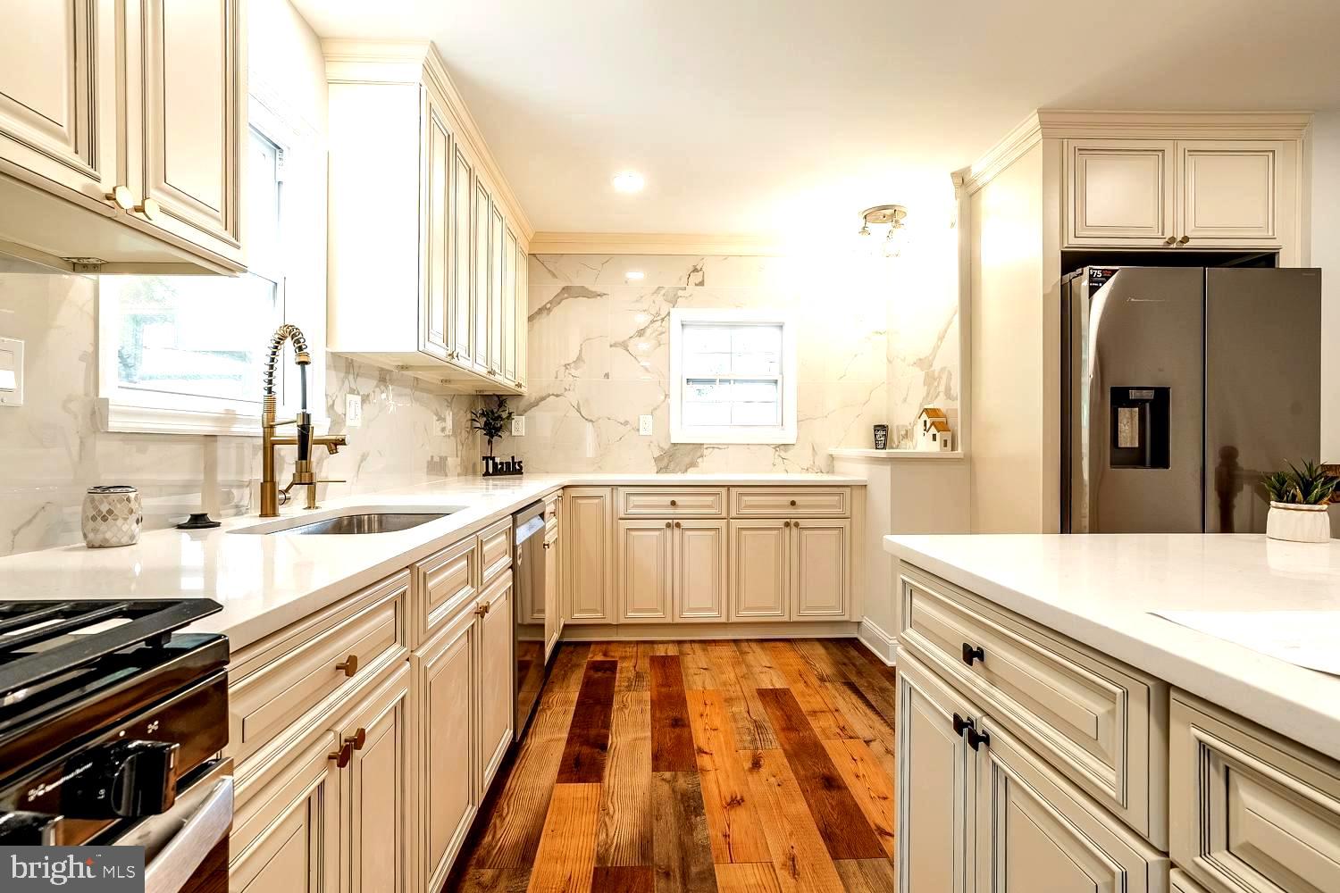 431 East Park Avenue Maple Shade, NJ 08052 - Photo 9 of 36 a kitchen with a sink stove and refrigerator