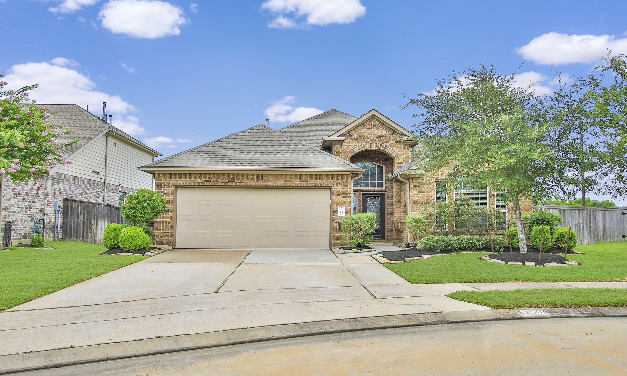 17506 Field Row Trail Hockley, TX 77447 - Photo 25 of 27 a front view of a house with a yard and garage
