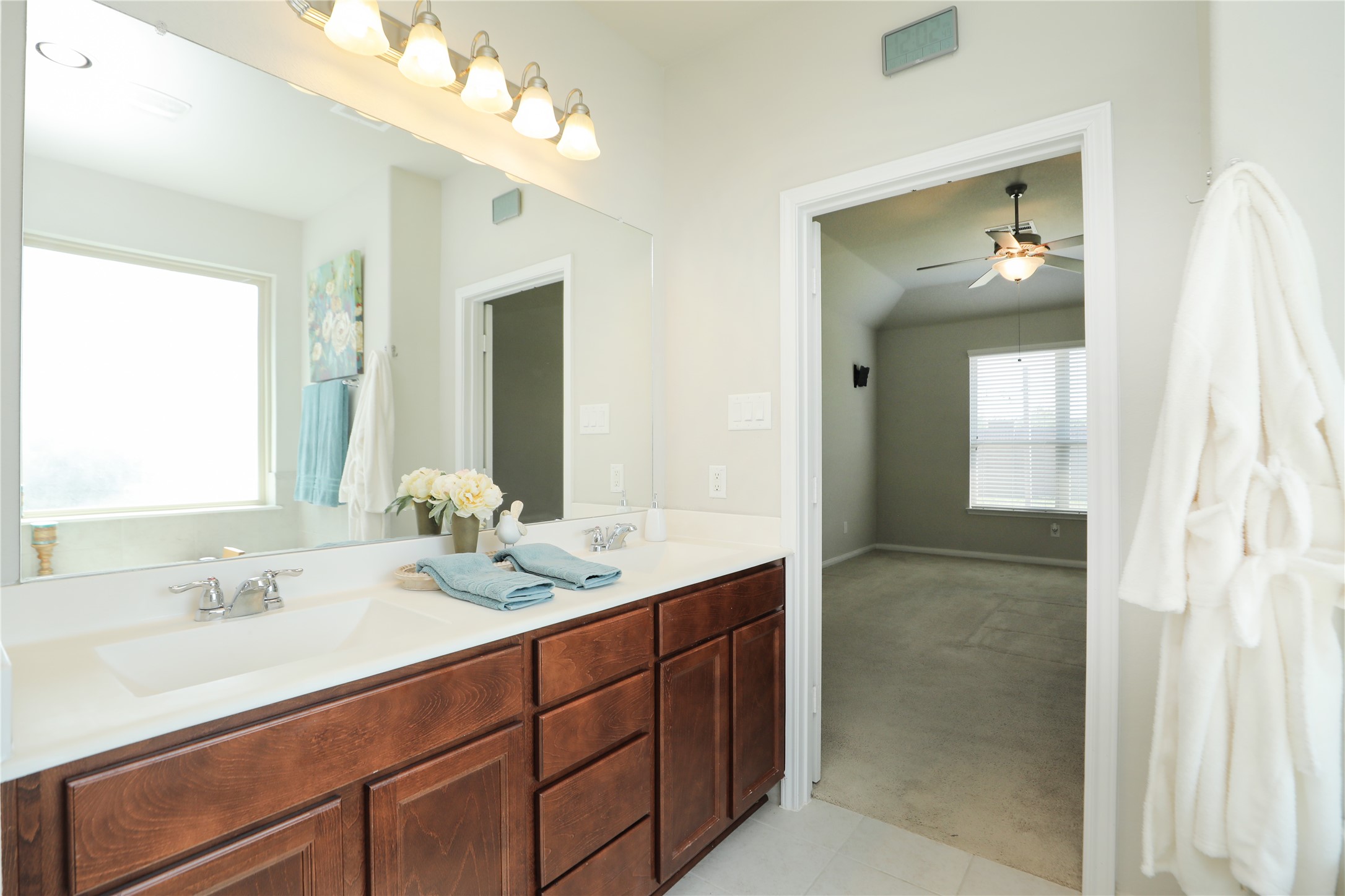 17506 Field Row Trail Hockley, TX 77447 - Photo 10 of 27 a bathroom with a double vanity sink and a mirror