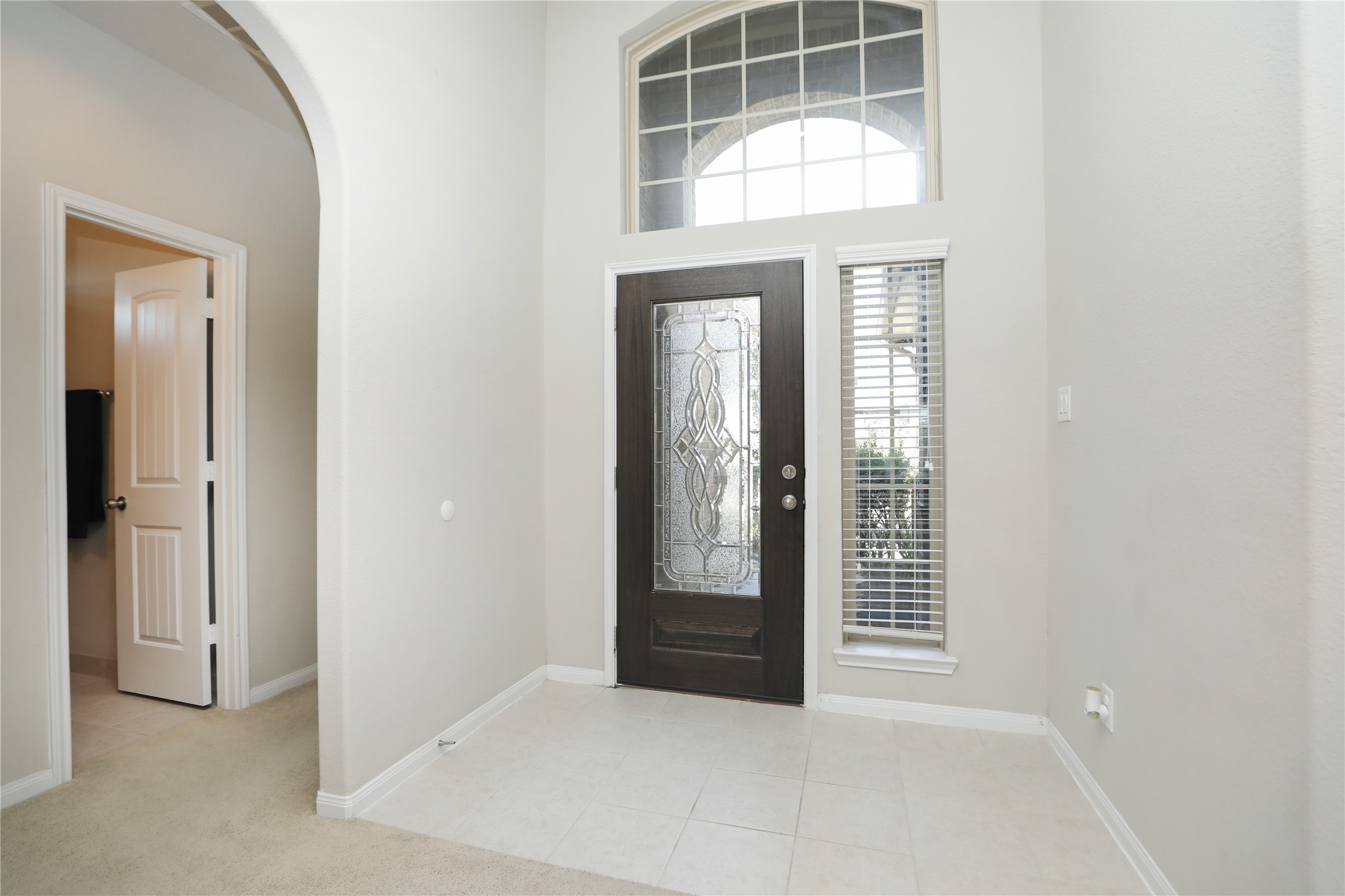 17506 Field Row Trail Hockley, TX 77447 - Photo 13 of 27 an entryway with wooden floor and windows