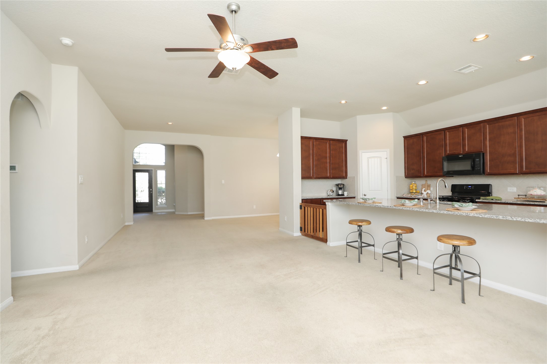 17506 Field Row Trail Hockley, TX 77447 - Photo 2 of 27 a view of kitchen with furniture and a ceiling fan
