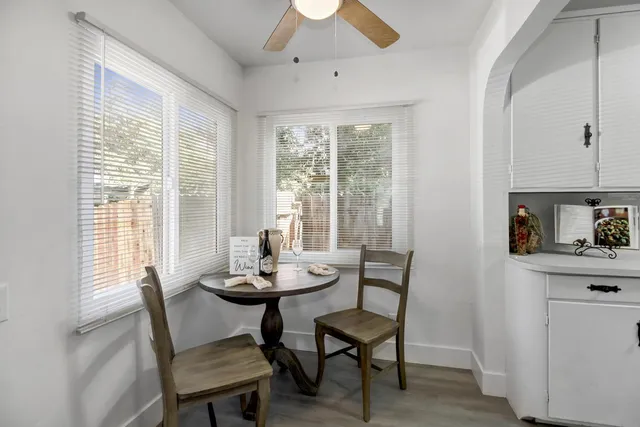 a dining room with furniture and window