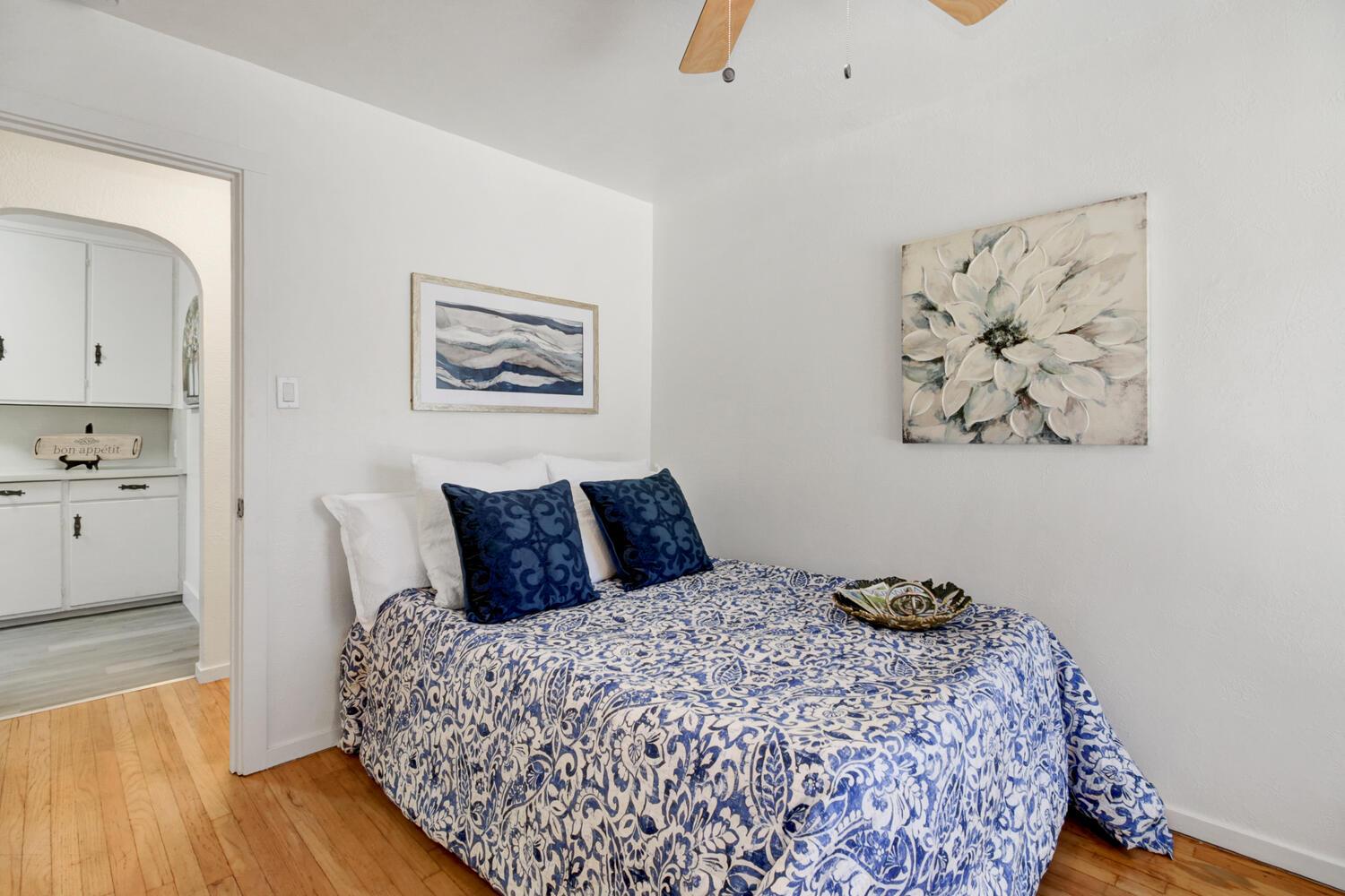 218 Folsom Road Roseville, CA 95678 - Photo 17 of 37 a bedroom with a bed and wooden floor