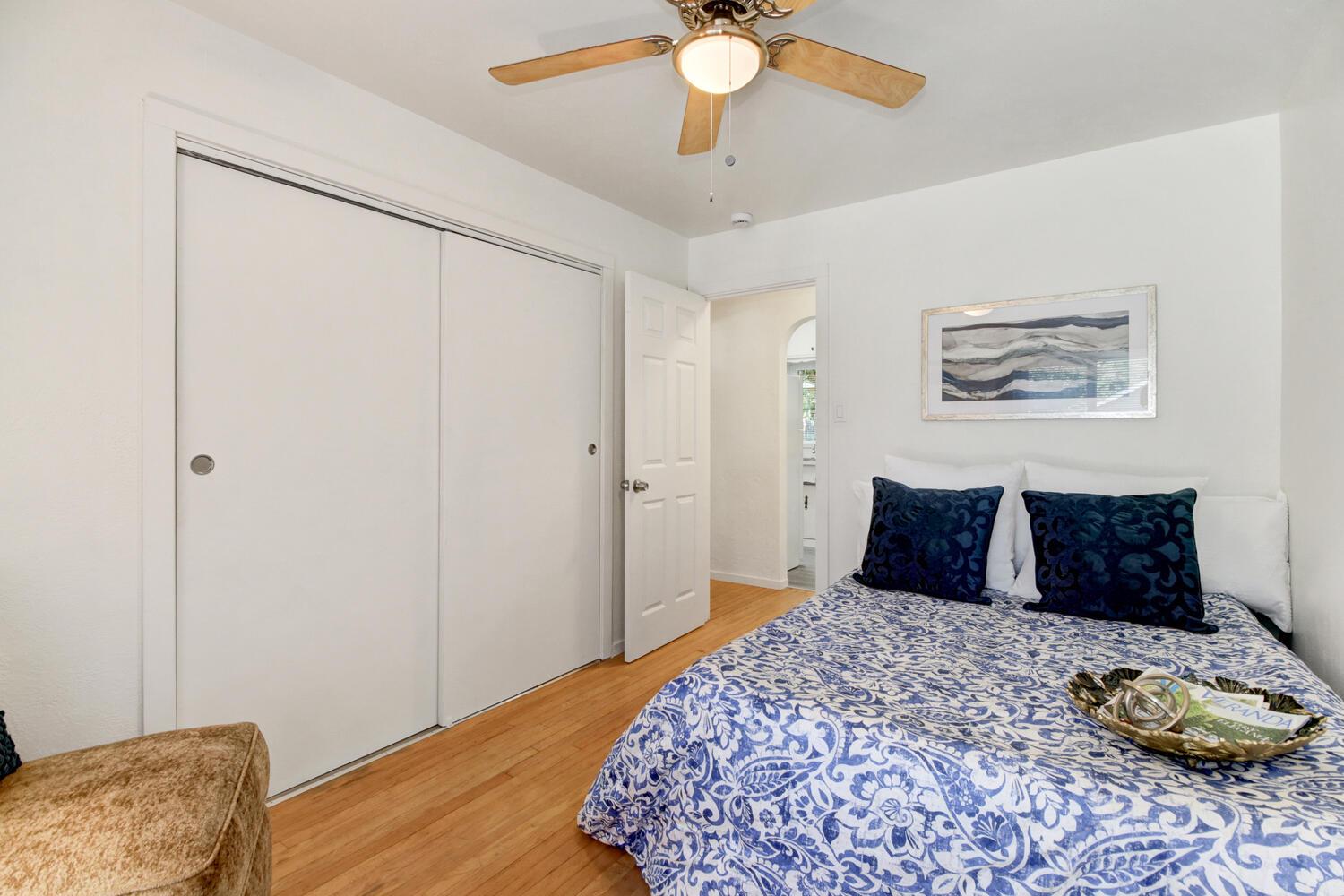 218 Folsom Road Roseville, CA 95678 - Photo 18 of 37 a bedroom with a bed and a chandelier