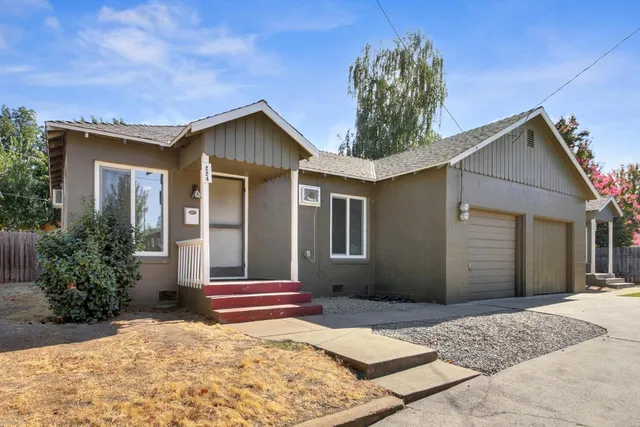 a house view with a backyard space