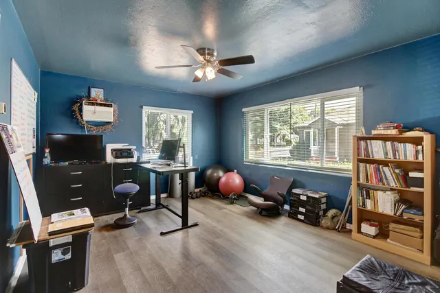 a room with gym equipment and a window
