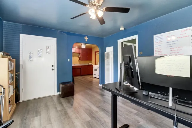 a room with furniture and a flat screen tv