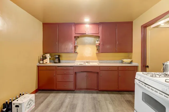 a bathroom with a granite countertop sink and a vanity